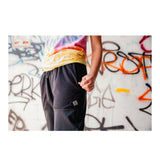 Hearthstone POINT3 DRYV® Black Joggers - Standing Model in Front of Graffiti Wall View